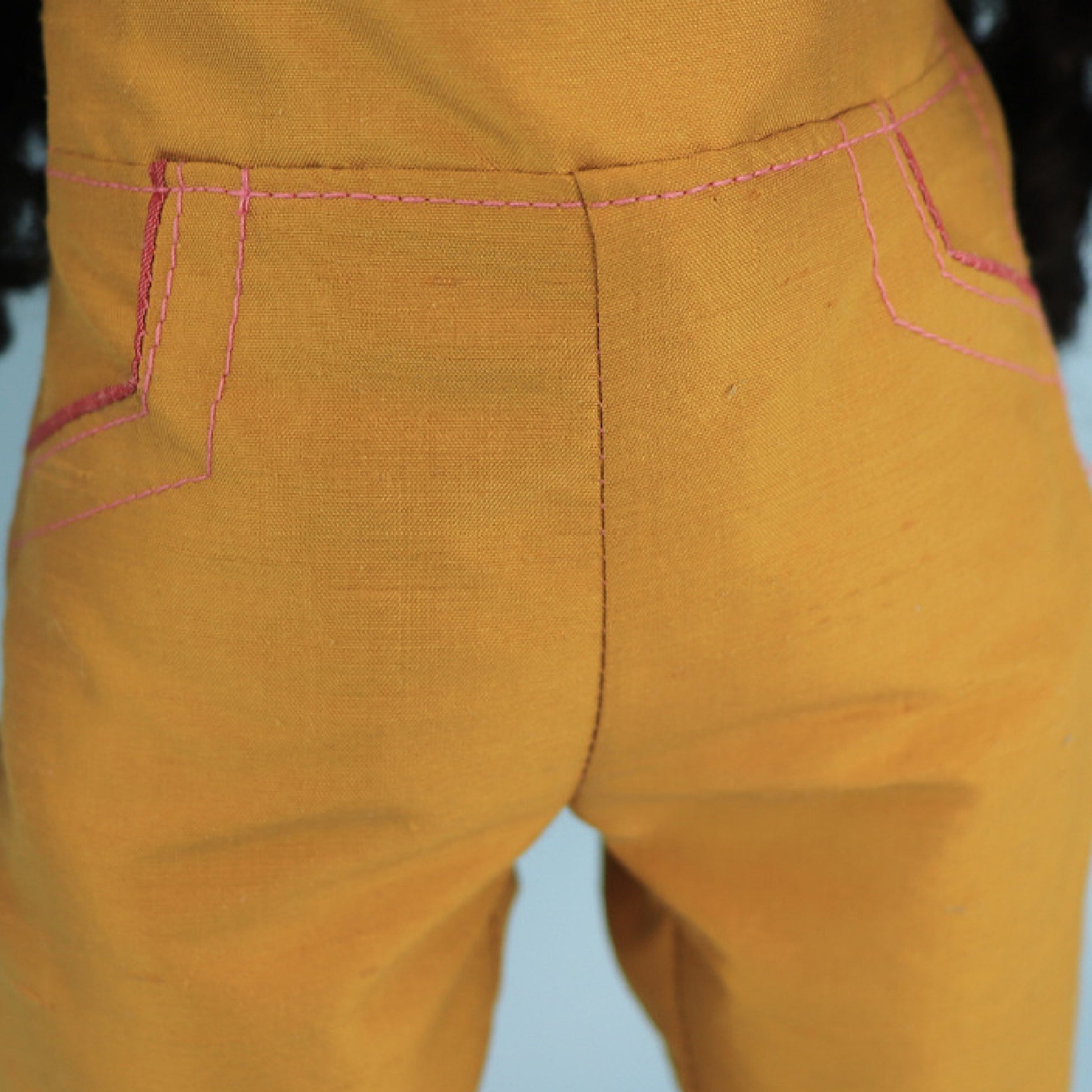 Audrey Capri pants, American girl pdf sewing pattern. Fits 18 inch dolls. Faux pockets, flat front waistband, elasticated in the back. Velcro closure. Comes with video tutorial. Pocket close up.