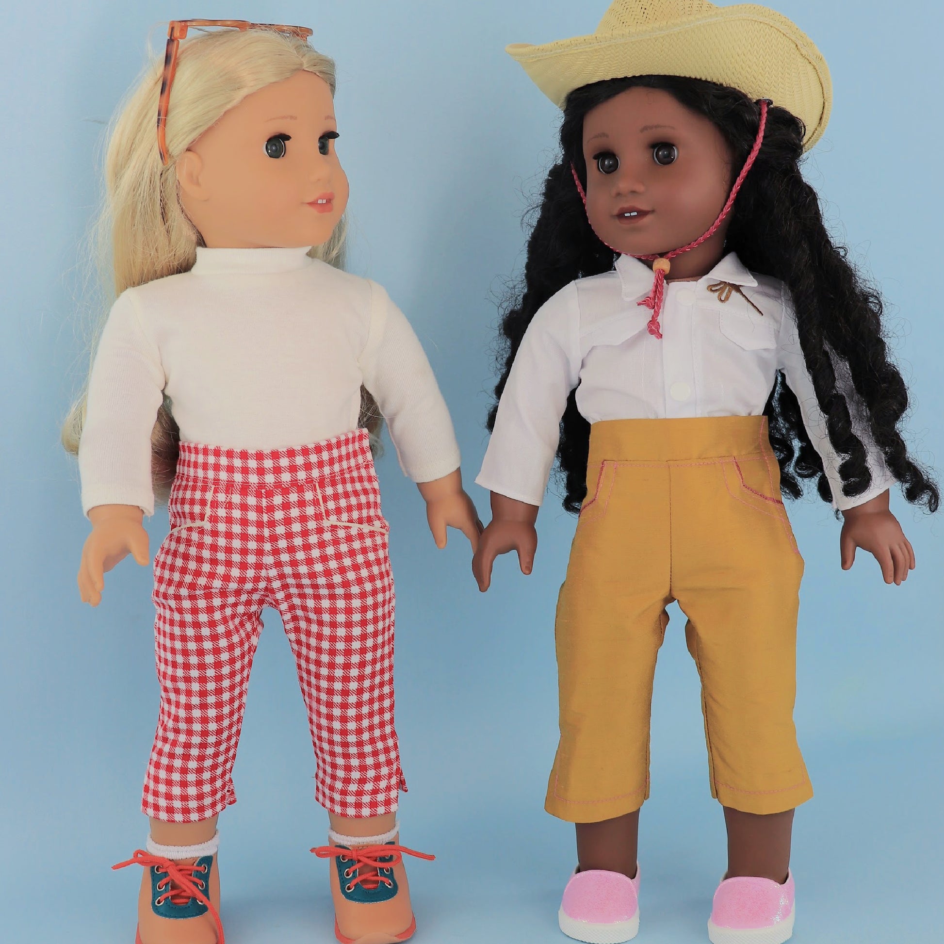 Audrey Capri pants, American girl pdf sewing pattern. Fits 18 inch dolls. Faux pockets, flat front waistband, elasticated in the back. Hem with slit made in mustard dupion silk. Comes with video tutorial.