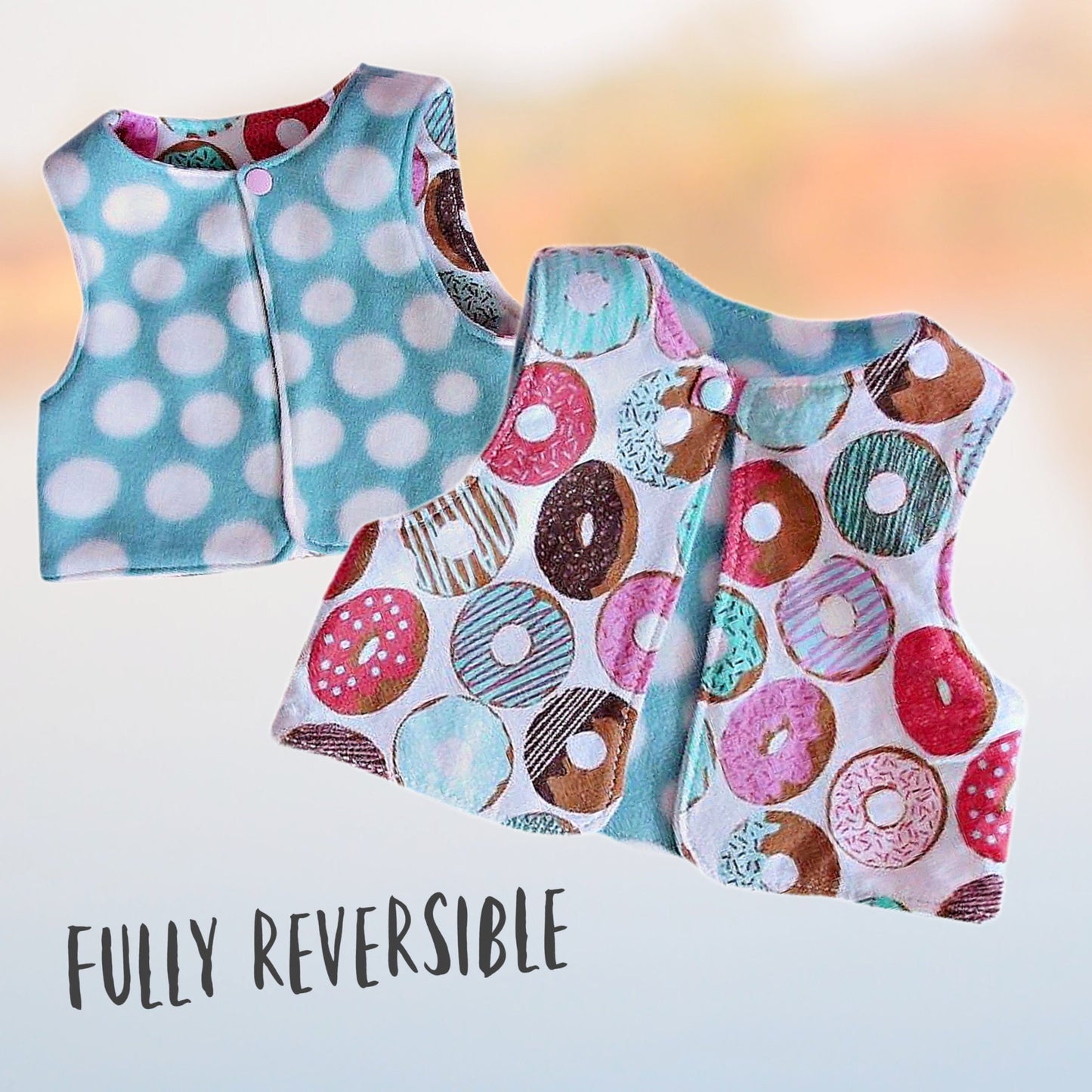 Baby vest, pdf sewing pattern, age 1-12. Fully reversible with cute KamSnap closure. In warm blue and white polka dot fleece and brushed cotton lining with large donut print.