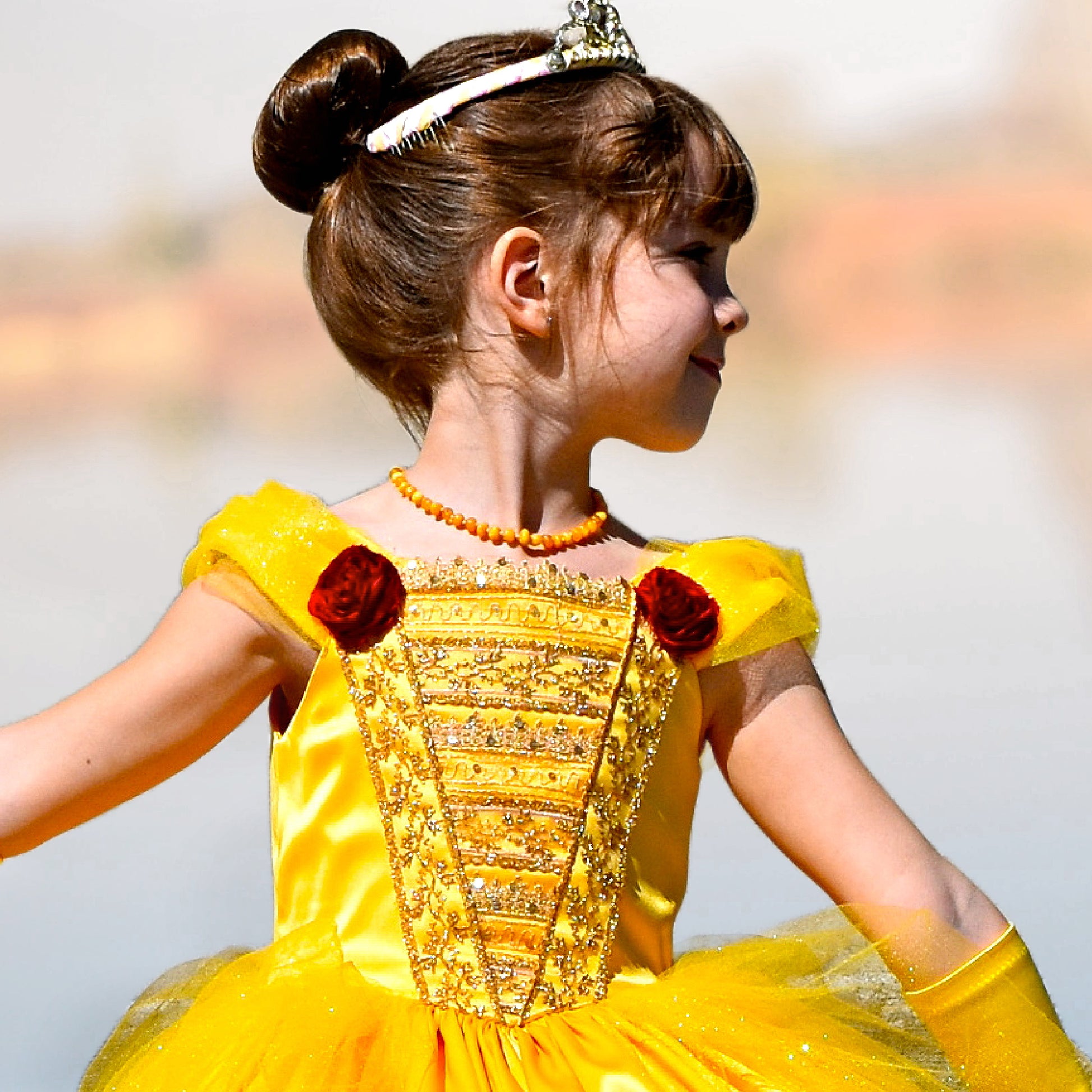 Belle costume, pdf sewing pattern by Frocks & Frolics. With classicrushed up skirt layers and panels. Gathered sleeve with embroidery and center front bodice. In gold duchess satin.