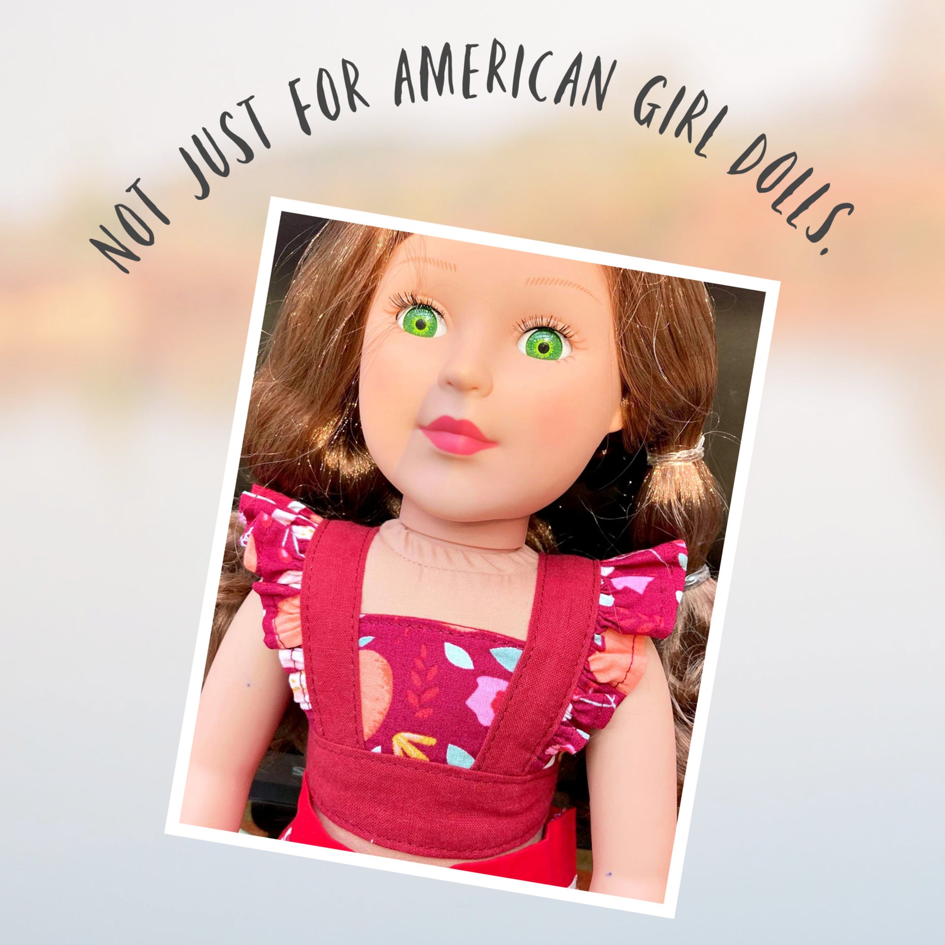 American girl doll, dressed in a flutter sleeve top and skirt. The skirt has a hem trim and is buttoned down the front. Both top and skirt are made using Michael Miller fabrics in pink cotton with a geometric pattern and a Letter themed print. Our Generation doll.