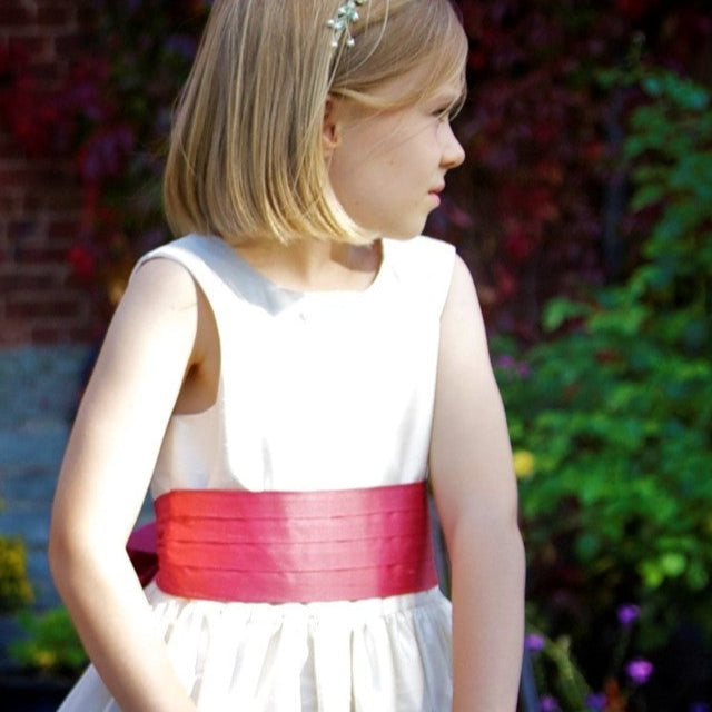 Flower girl dress pdf sewing pattern, cummerbund sash, big bow, classic flower girl frock, pink sash, cream bodice, covered buttons, rouleaux loop fastening. Free You Tube Video playlist. View of cummerbund and pearl embroidery.