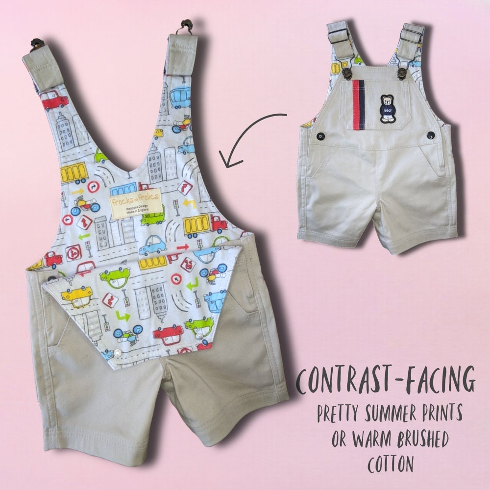 Bobby Dazzler overalls pdf sewing pattern. Short version. Classic dungaree pattern by Frocks and Frolics. Features leg opening for nappy changes, western pockets, a bib, snaps and metal jeans buttons. Sewing pattern includes a video course.