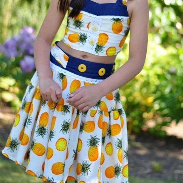 Bonnie twirl skirt with yoke and a gathered circle skirt. With gorgeous lace trim and generous back ties, pdf sewing pattern by frocks and frolics.