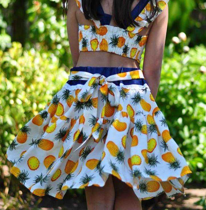 Bonnie twirl skirt with yoke and a gathered circle skirt. With gorgeous lace trim and generous back ties, pdf sewing pattern by frocks and frolics.