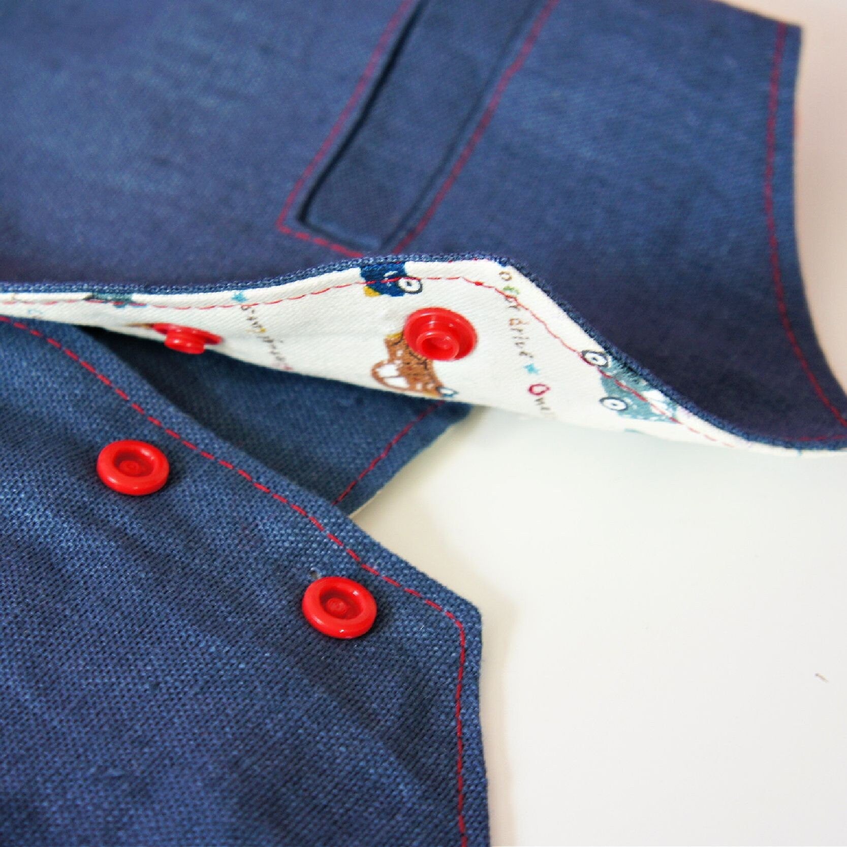 Brooklyn waistcoat, pdf sewing pattern by frocks and frolics. Fully lined with tie backs. Close up of the front KamSnap closure. Includes a free video sewing course.