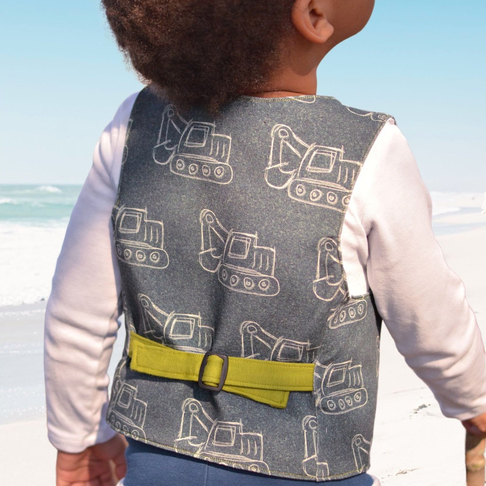 Brooklyn waistcoat, pdf sewing pattern by frocks and frolics. Fully lined with tie backs. Back view featuring lime green ties. Includes a free video sewing course.