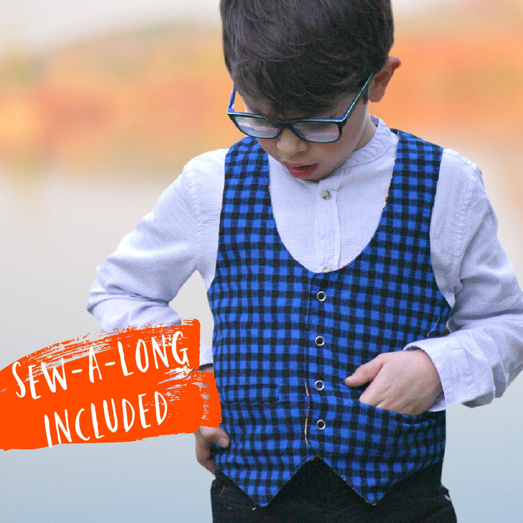 Brooklyn waistcoat, pdf sewing pattern by frocks and frolics. Fully lined with tie backs. Cute boy with one hand in pocket. Gingham fabric. Includes a free video sewing course.
