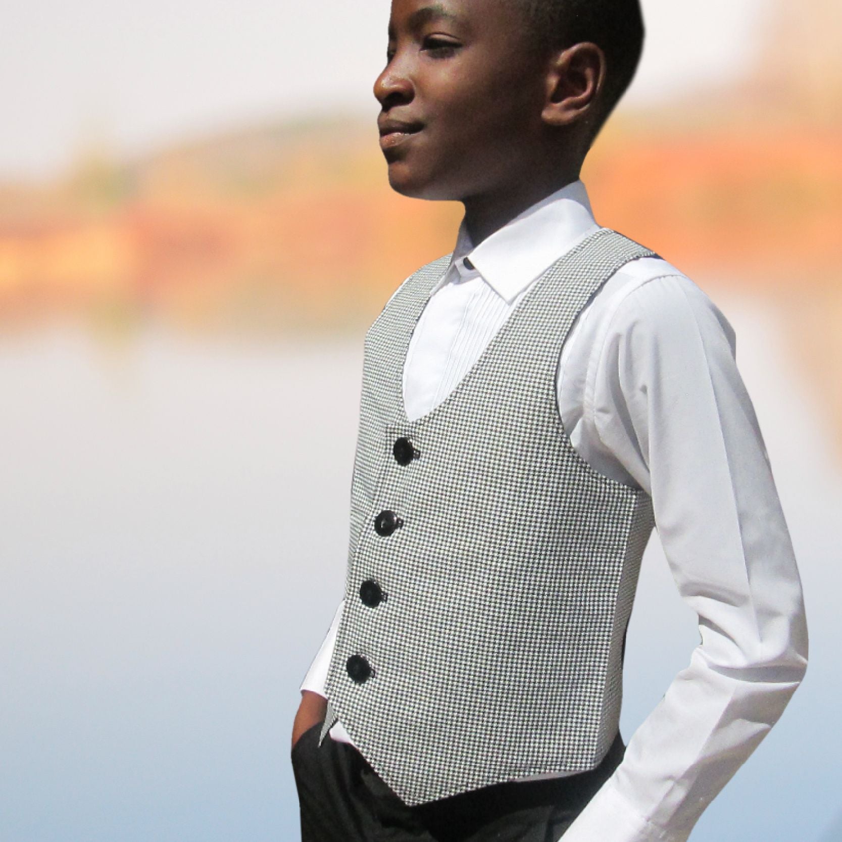 Brooklyn waistcoat, pdf sewing pattern by frocks and frolics. Fully lined with tie backs. Side view. Includes a free video sewing course.