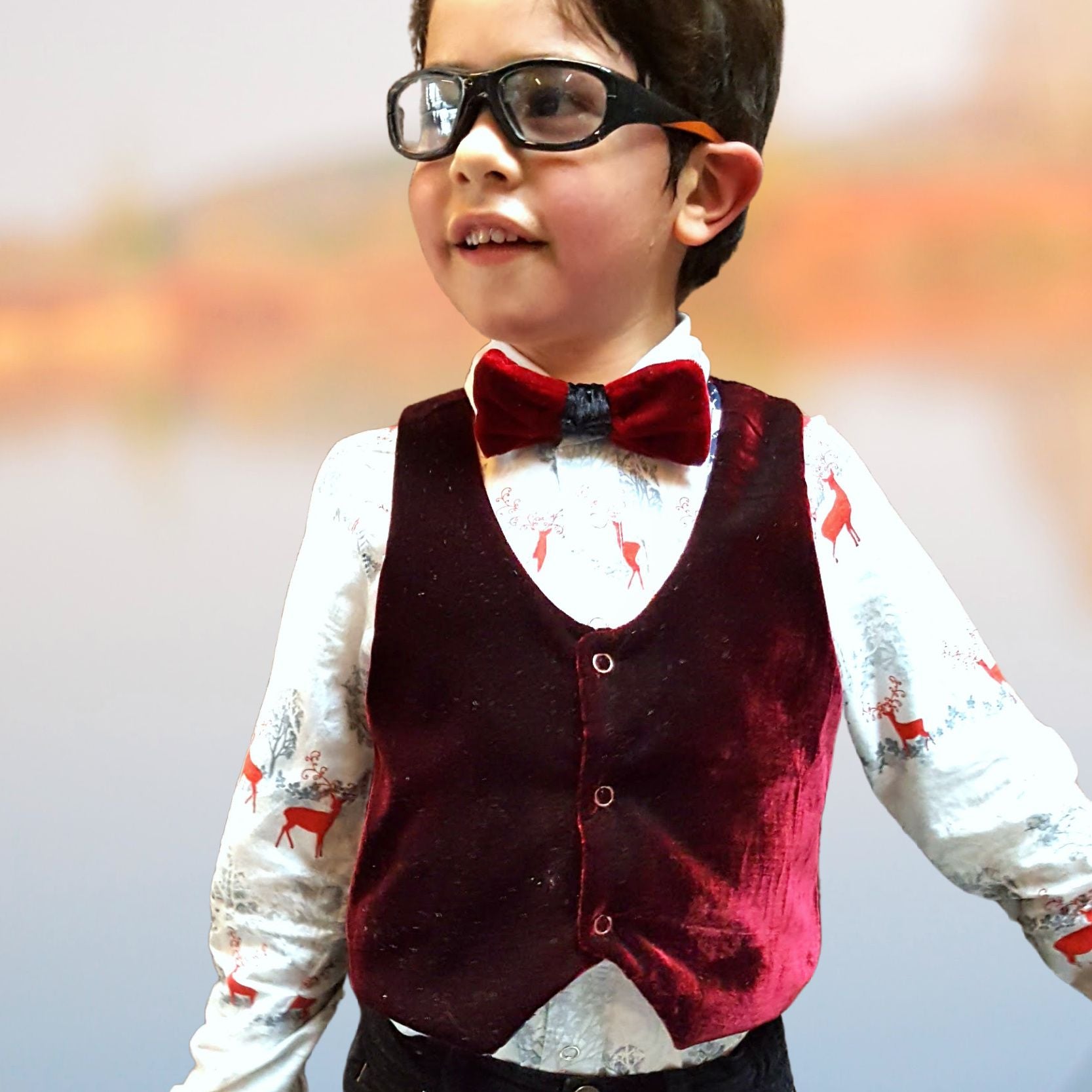 Brooklyn waistcoat, pdf sewing pattern by frocks and frolics. Fully lined with tie backs. In red velvet, perfect for Christmas. Includes a free video sewing course.
