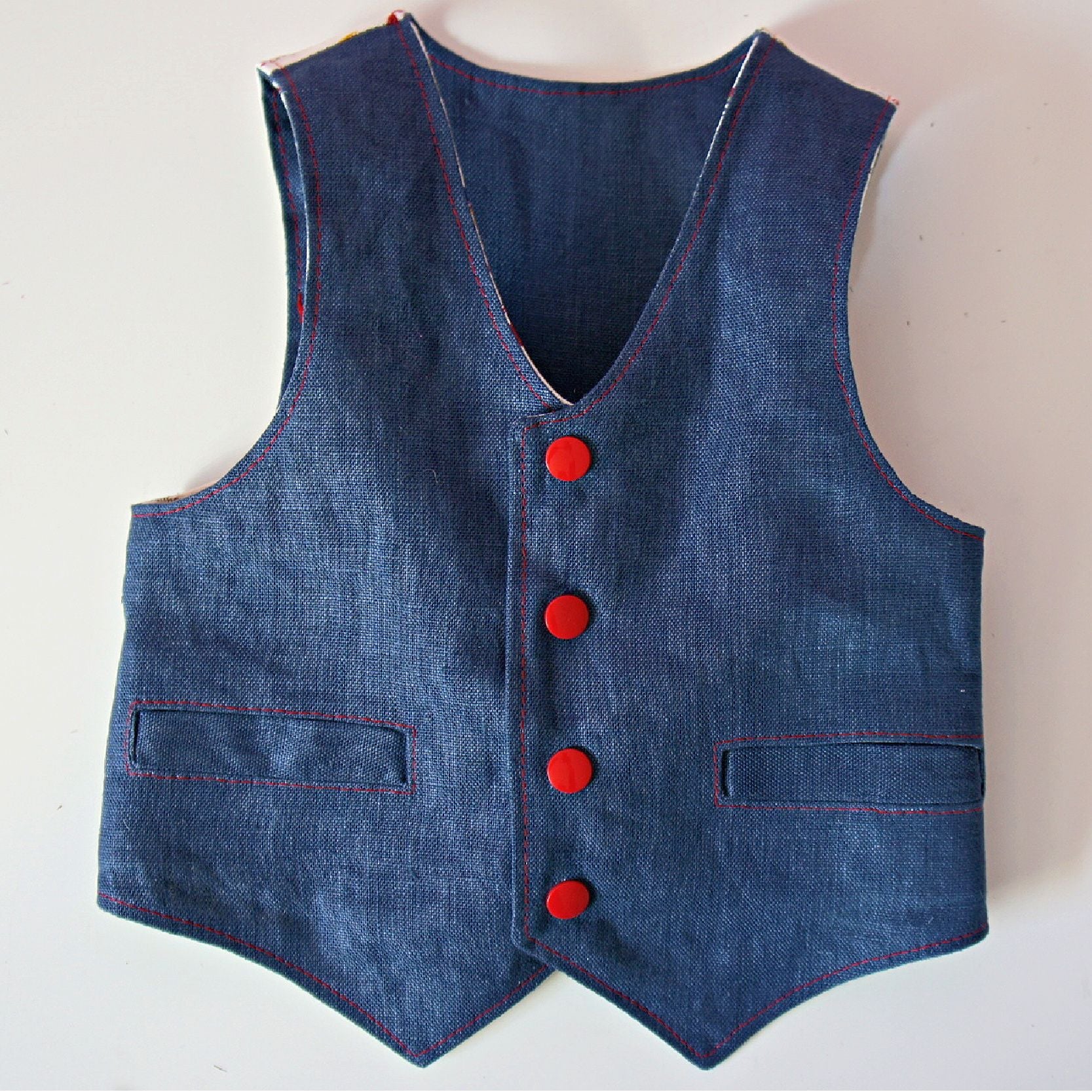 Brooklyn waistcoat, pdf sewing pattern by frocks and frolics. Fully lined with tie backs. Use KamSnaps for the front closure or buttons. Comes with a fre video tutorial.