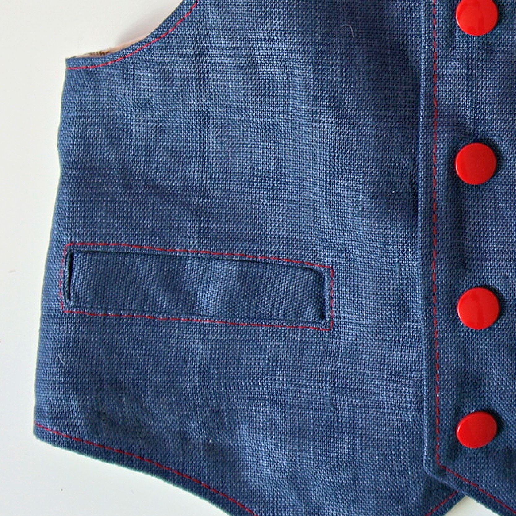 Brooklyn waistcoat, pdf sewing pattern by frocks and frolics. Fully lined with tie backs. Close up of the welt pocket. Includes a free video sewing course.