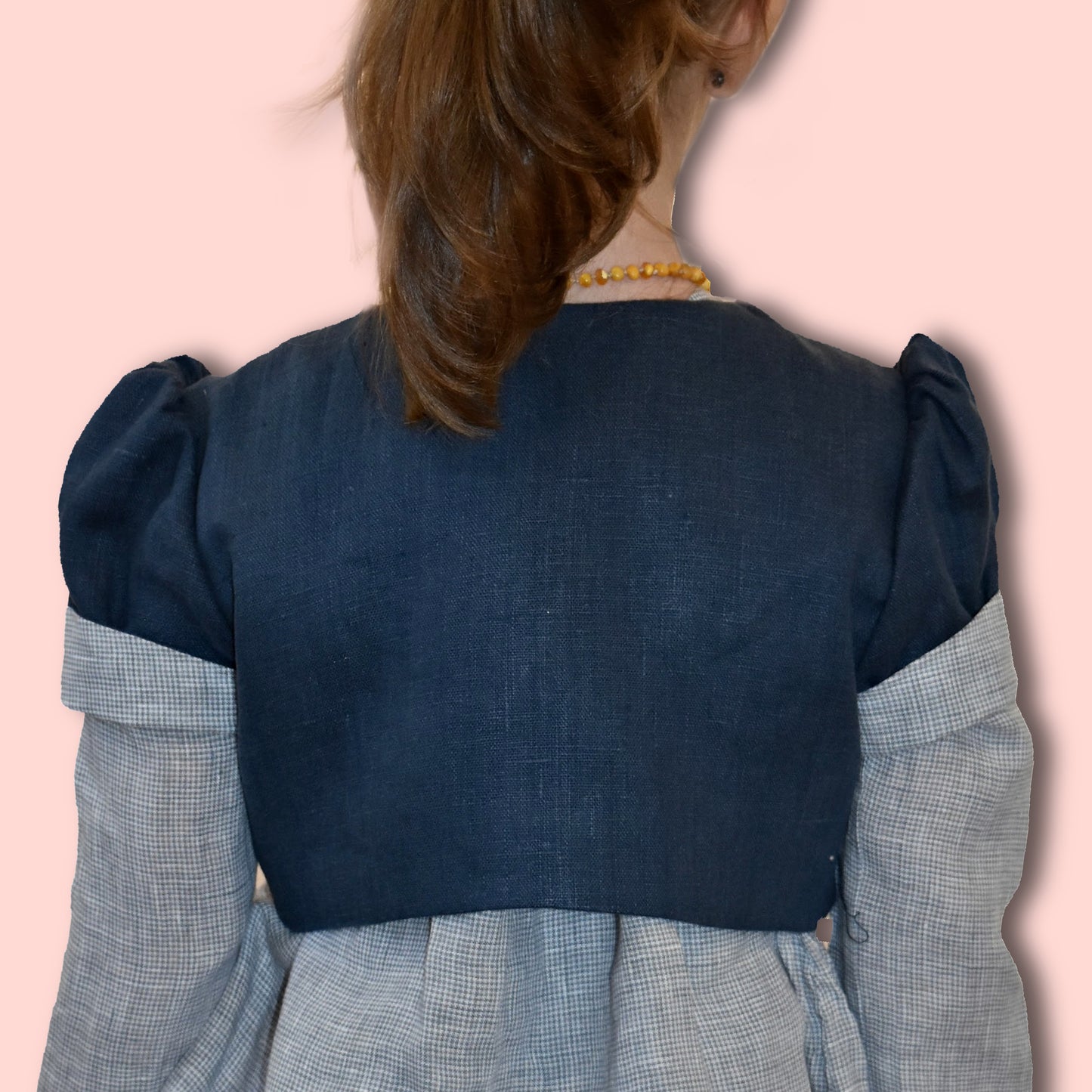 Bolero jacket, pdf sewing pattern by frocks and frolics. With puff sleeves or elasticated sleeves or pretty bias binding. Fully lined. In blue linen with Gingham lining and sleeve cuffs.