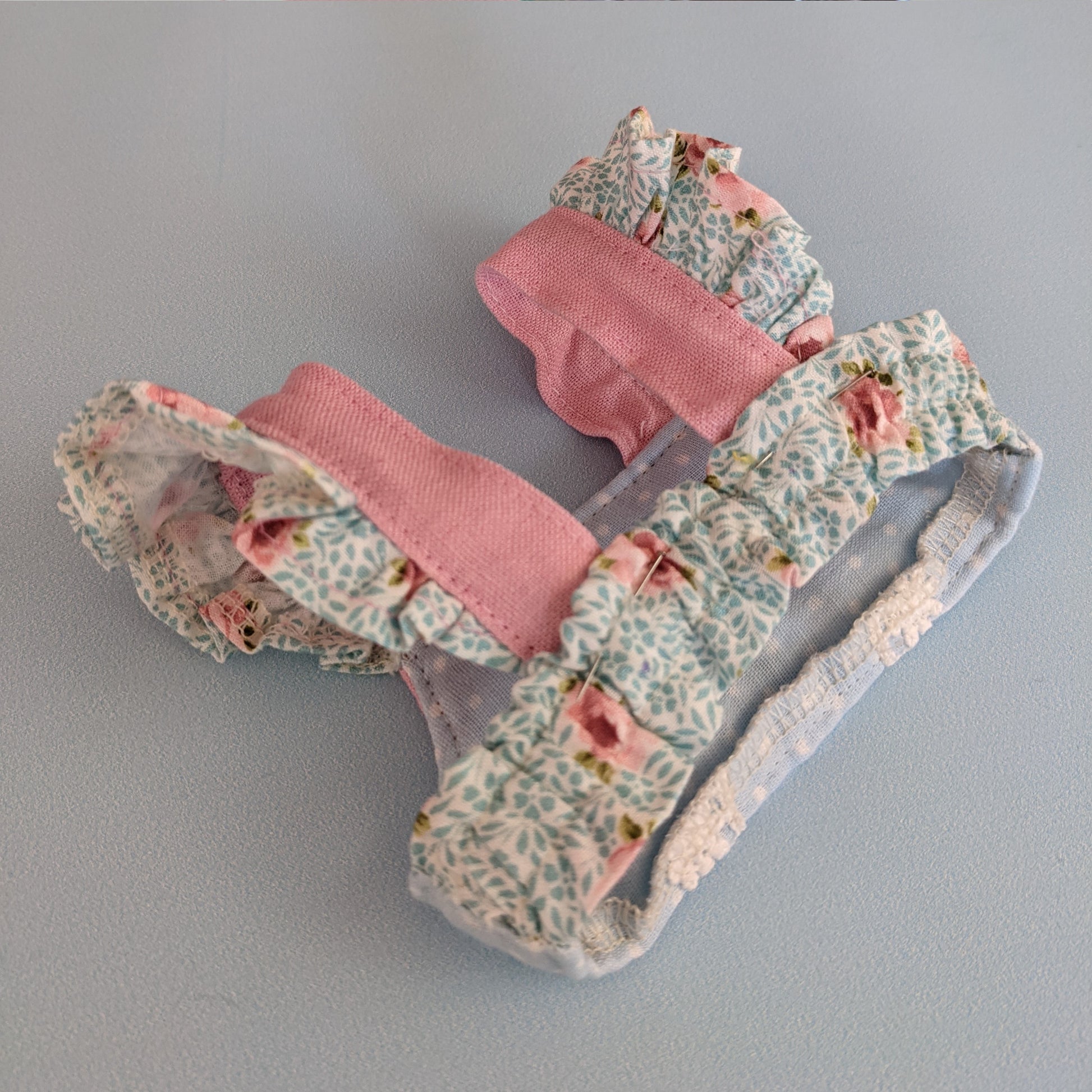 Bonnie & Connie American girl doll clothes by Frocks & Frolics. Gorgeous cropped top and twirl skirt in pastel blue fabrics. With flutter sleeves and big circle skirt. Back view.