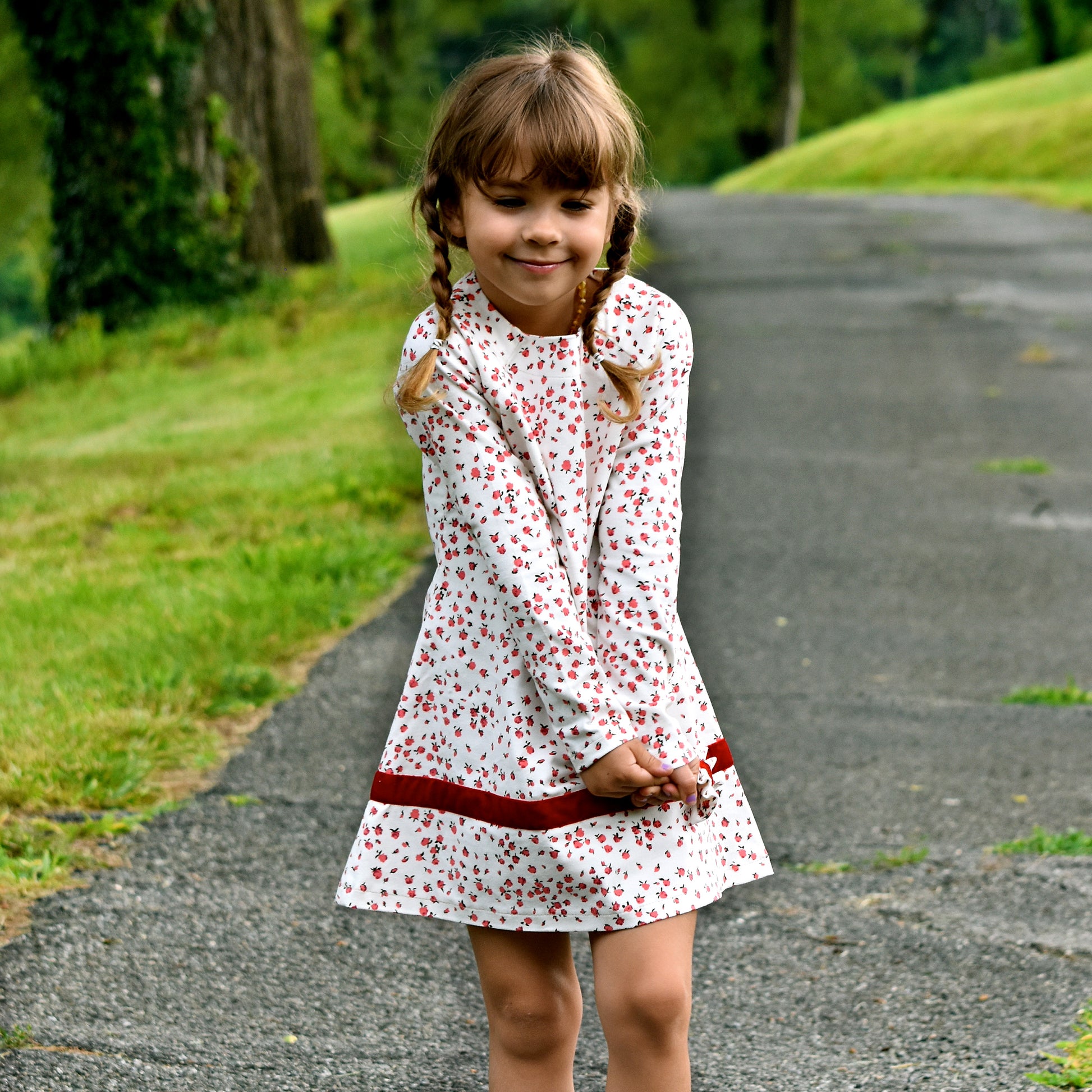Daisy dress, pdf sewing pattern. Jersey dress with long raglan sleeves and faux turn up. The dress has a KamSnap back closure and deep decorative hem trim. The pattern comes with a step-by-step video tutorial.