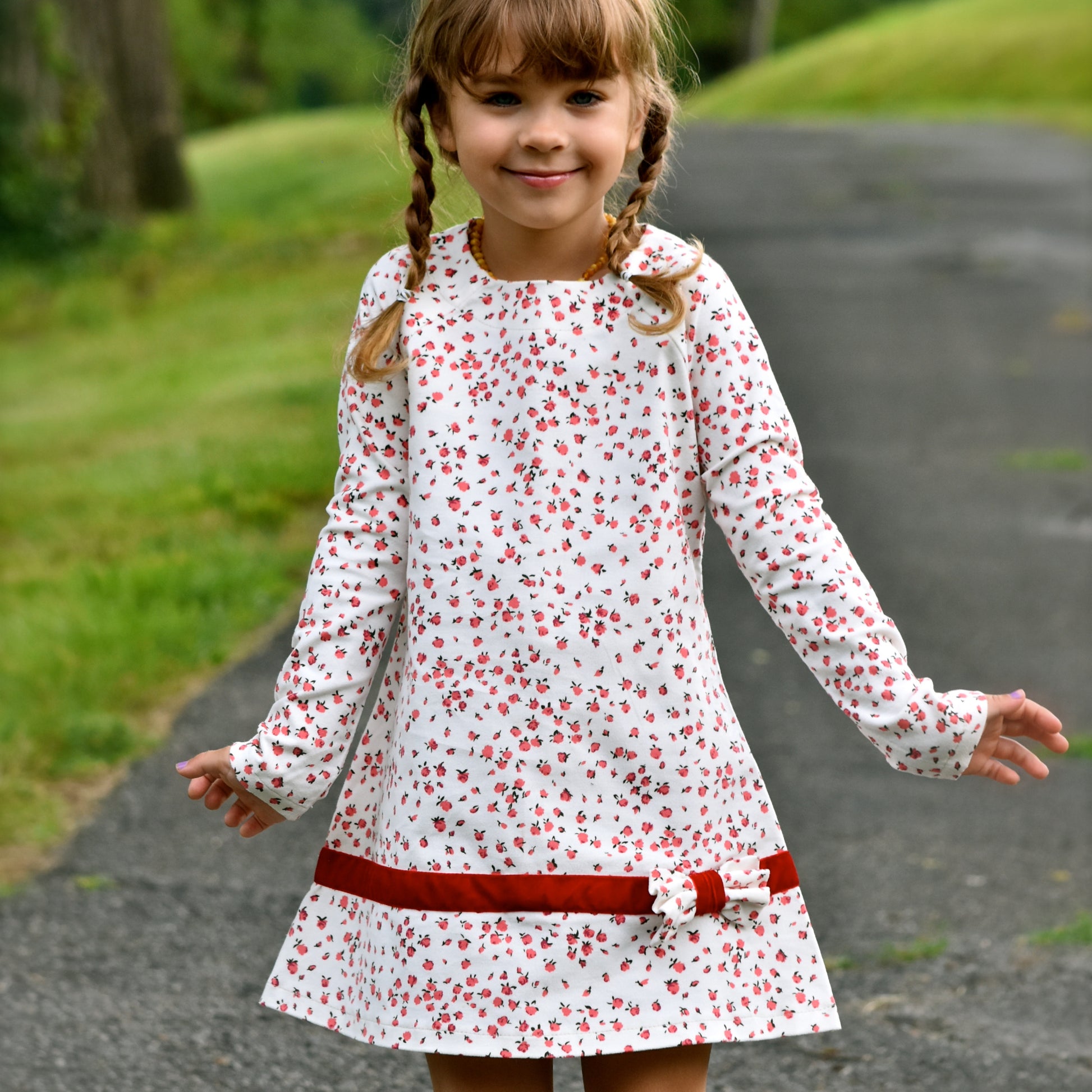 Daisy dress, pdf sewing pattern. Jersey dress with long raglan sleeves and faux turn up. The dress has a KamSnap back closure and deep decorative hem trim. The pattern comes with a step-by-step video tutorial.