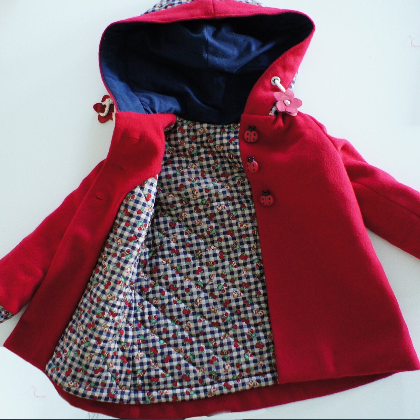 Dakota Pea Coat, pdf sewing pattern by Frocks and Frolics. Fully lined wool coat with hoodie or collar. The sewing pattern comes with video tutorials.