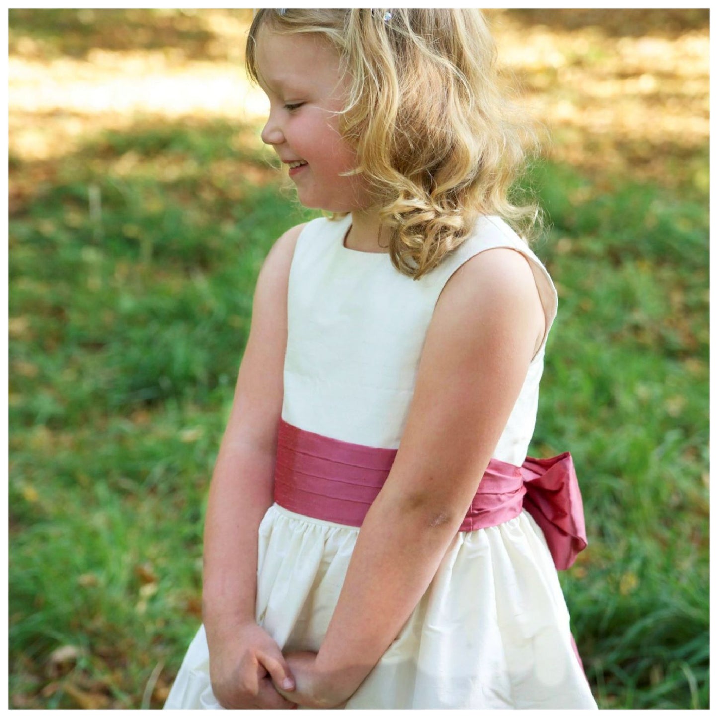 Flower girl dress pdf sewing pattern, cummerbund sash, big bow, classic flower girl frock, pink sash, cream bodice, covered buttons, rouleaux loop fastening. Free You Tube Video playlist.