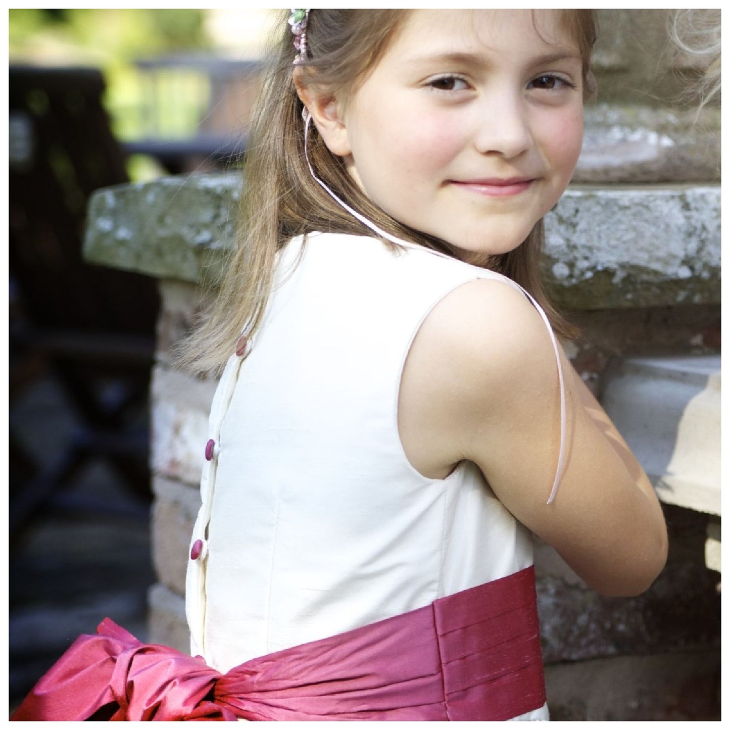 Flower girl dress pdf sewing pattern, cummerbund sash, big bow, classic flower girl frock, pink sash, cream bodice, covered buttons, rouleaux loop fastening. Free You Tube Video playlist.
