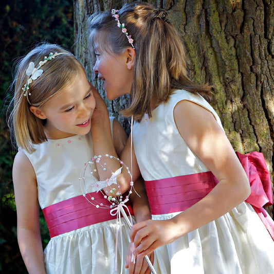 Flower girl dress pdf sewing pattern, cummerbund sash, big bow, classic flower girl frock, pink sash, cream bodice, covered buttons, rouleaux loop fastening. Free You Tube Video playlist. View of cummerbund and pearl embroidery.