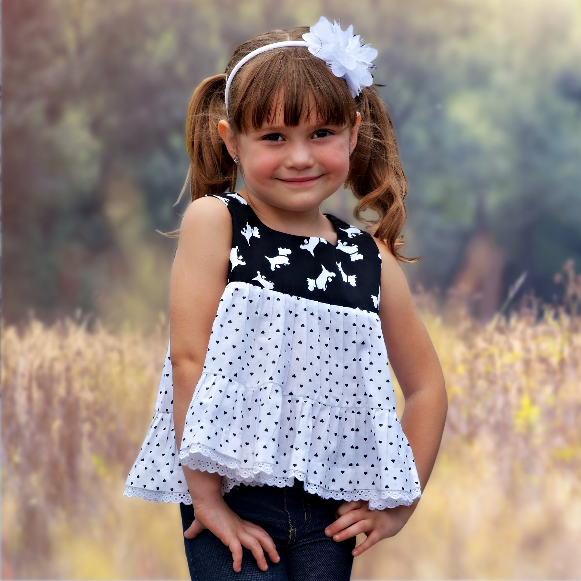 Georgina dress pdf sewing pattern by Frocks & Frolics, high waisted bodice, applique how to in printed cotton. Front view.