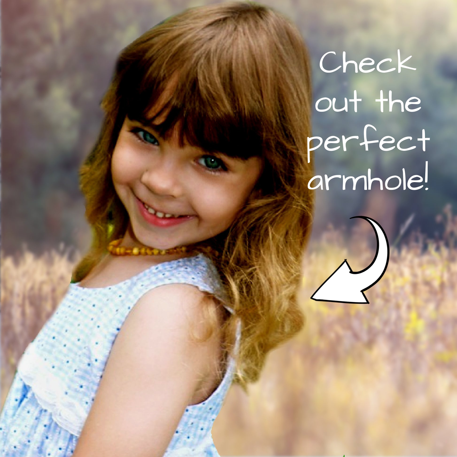 Georgina dress pdf sewing pattern by Frocks & Frolics, high waisted bodice, applique how to in printed cotton. Close up of an armhole.