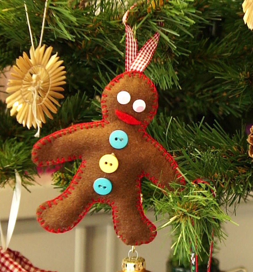 Felt gingerbread man ornament on a Christmas tree