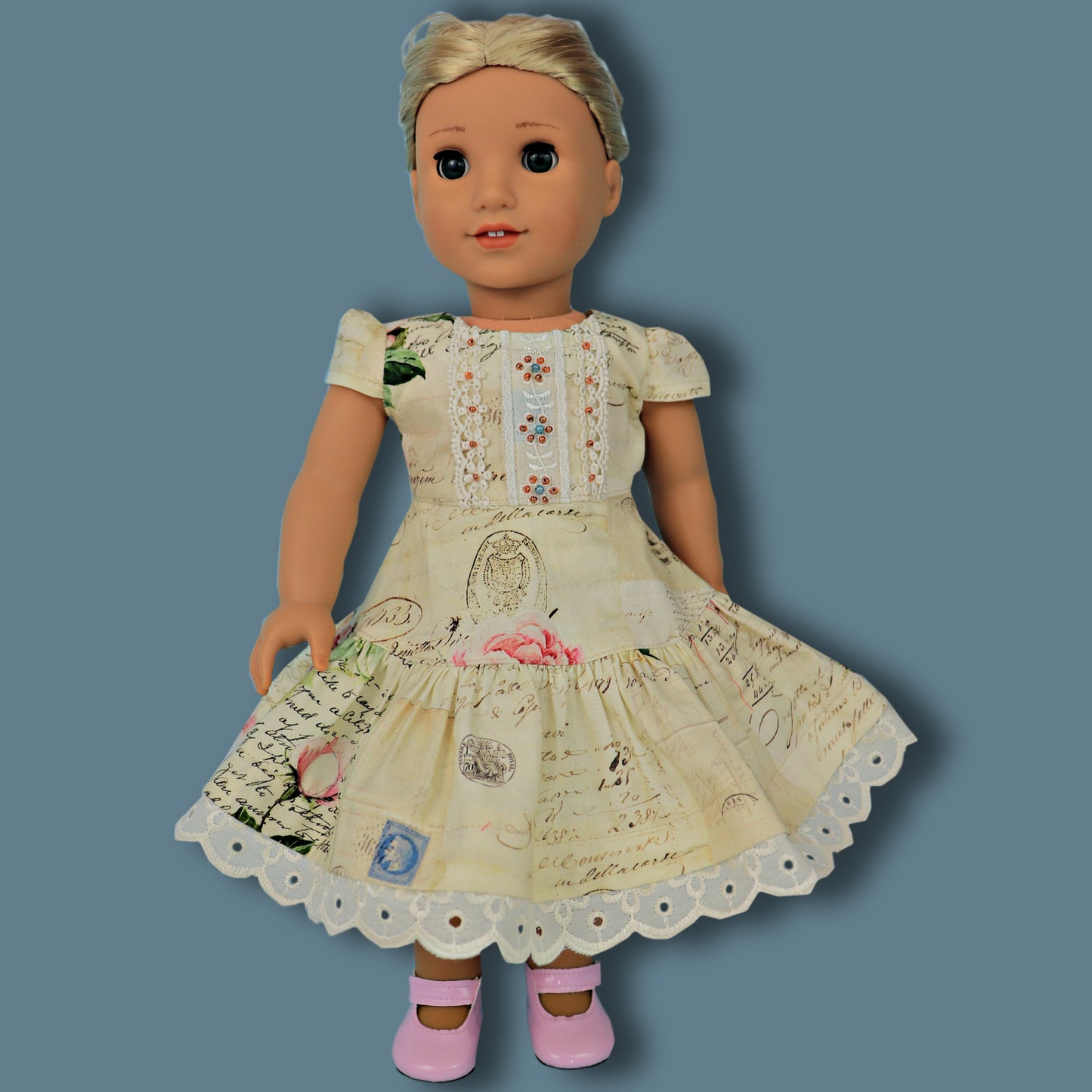 Isabella Doll dress, pdf sewing pattern for American Girl dolls. 18 inch doll clothes. Dress with pin tucks on the fron bodice and velcro closure. You get video tutorials for every step. Front view.