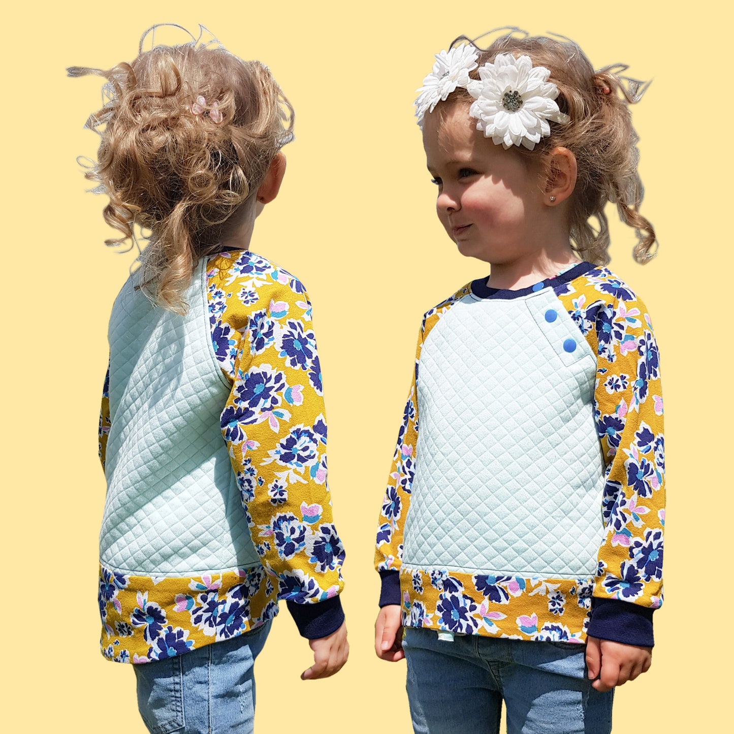 Jelly Bean Sweater, pdf sewing pattern by Frocks & Frolics. Raglan jumper with optional KamSnap opening in the raglan sleeve seam. High low hem trim and cuffs in contrast four way stretch interlock fabric. Includes a free video tutorial.
