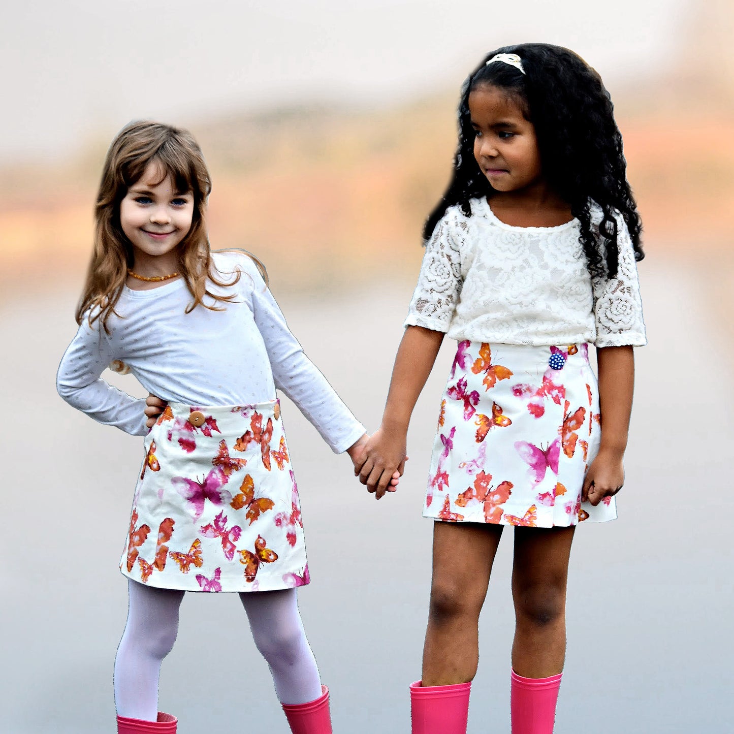 Cute wrap skirt with buttonclosure in gorgeous printed cream denim with a orange and purple butterfly print. PDF sewing pattern for age 1-12 by Frocks & Frolics. The pattern includes a video tutorial you can watch for free.