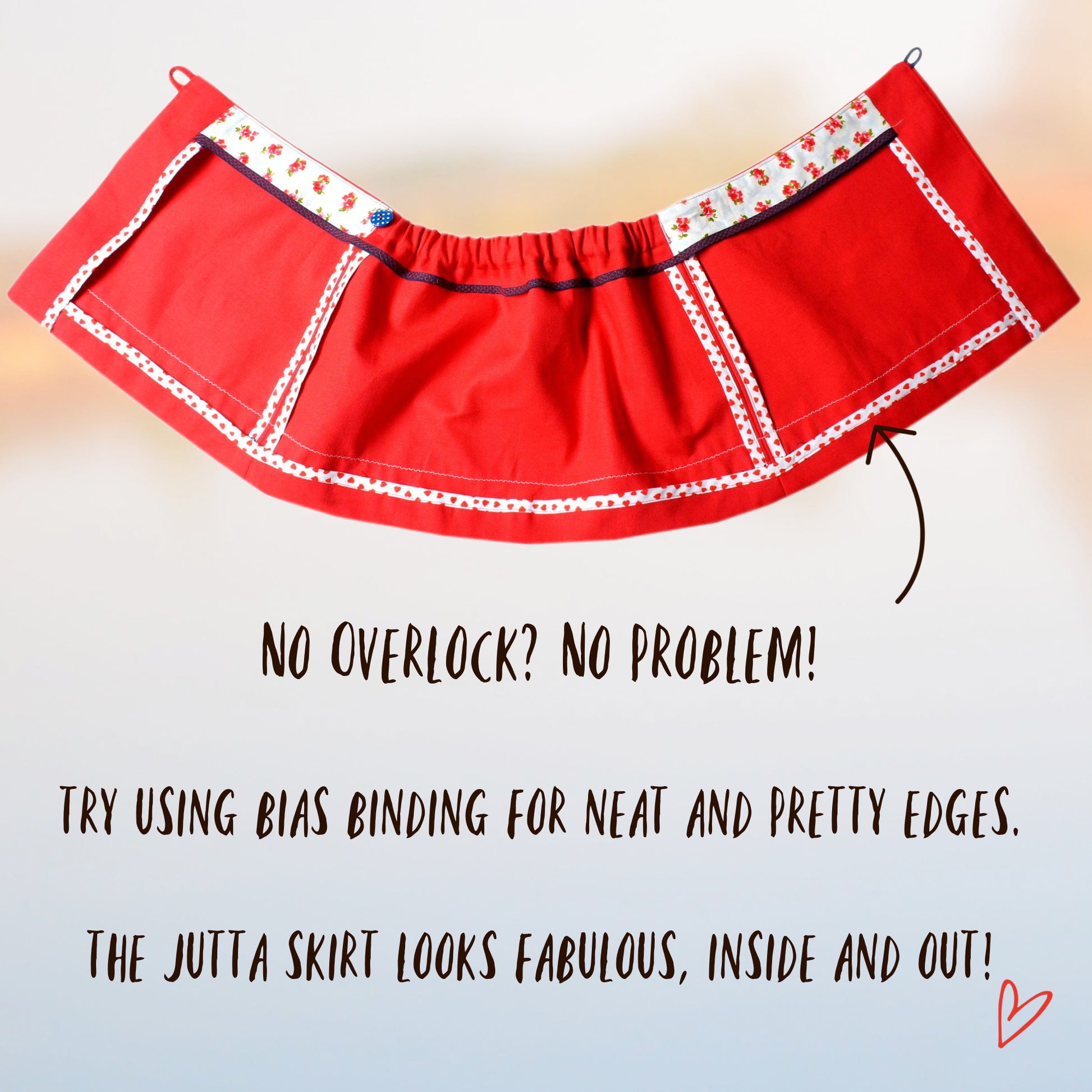 Cute wrap skirt with buttonclosure in gorgeous red linen with rick-rack embroidery. PDF sewing pattern for age 1-12 by Frocks & Frolics. The pattern includes a video tutorial you can watch for free. Inside view of hem and lining.