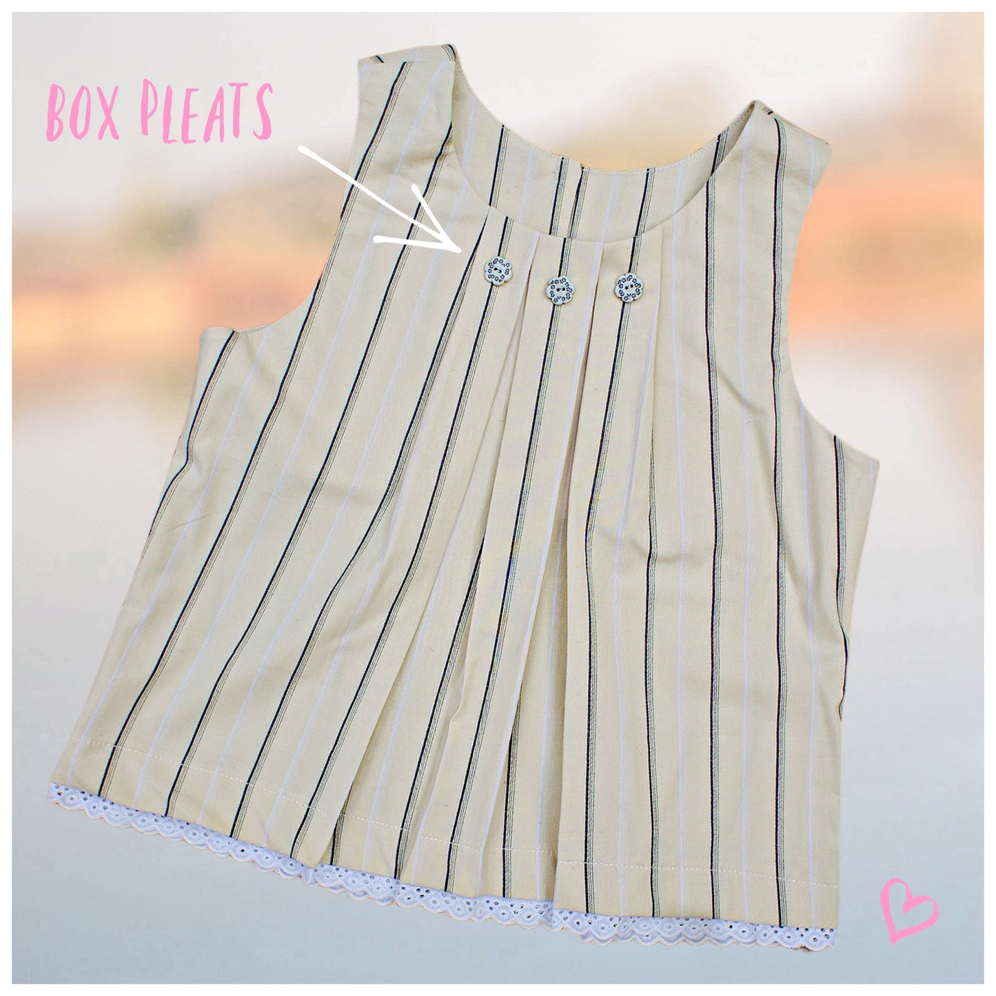Pretty sleeveless summer dress with front pleats which open out. A-line shape, knee length. Sewing pattern and free video tutorial by Frocks & Frolics.