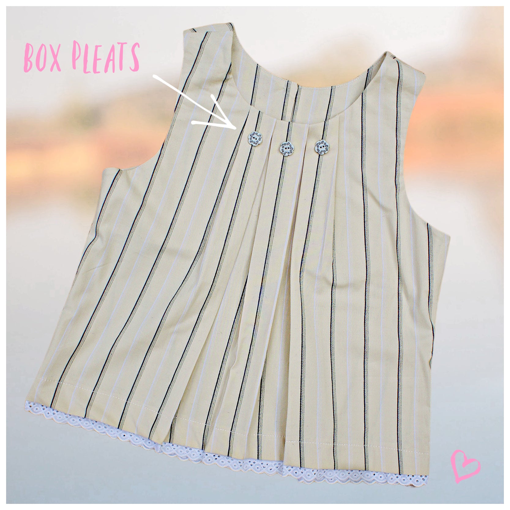 Pretty sleeveless summer dress with front pleats which open out. A-line shape, knee length. Sewing pattern and free video tutorial by Frocks & Frolics.