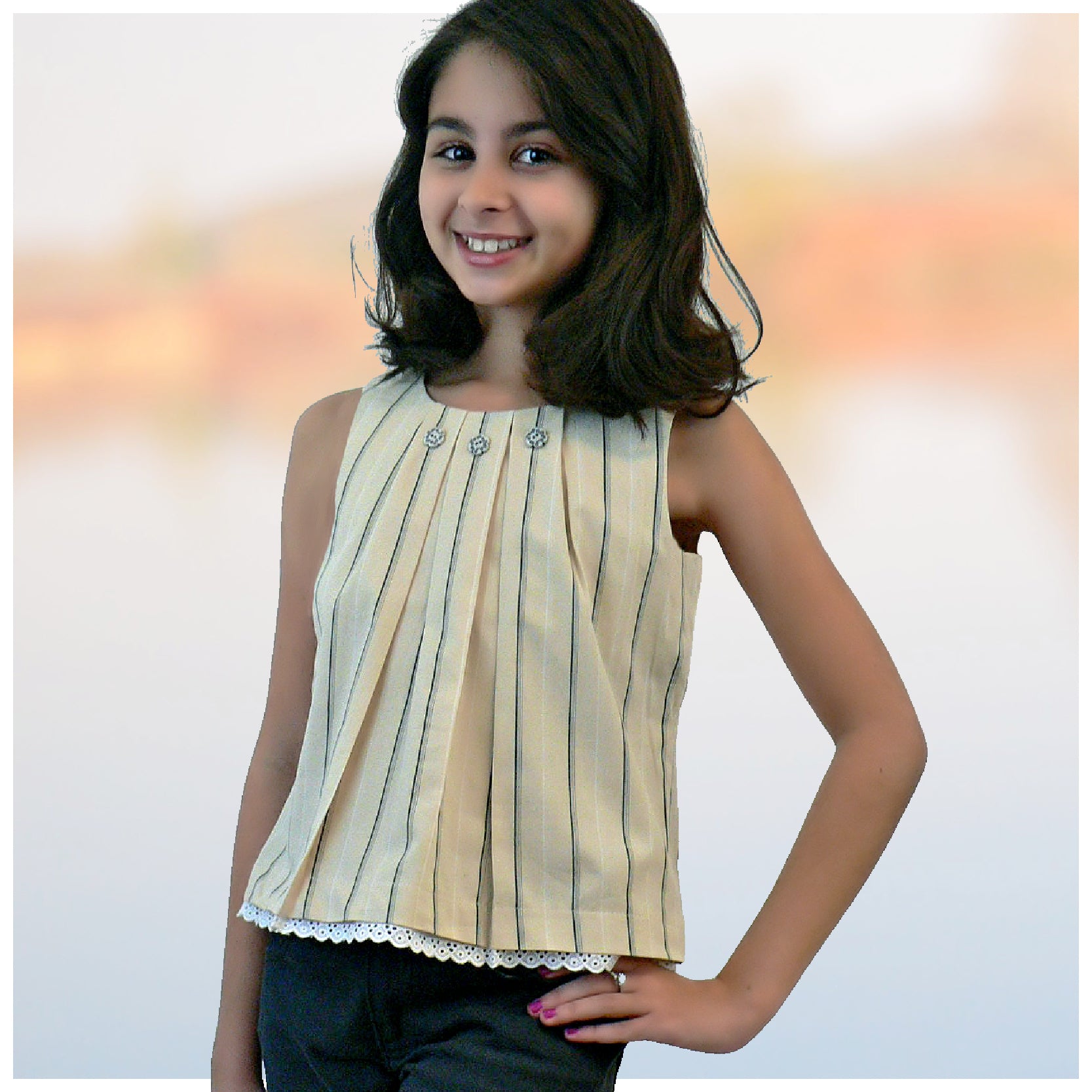 Pretty sleeveless summer dress with front pleats which open out. A-line shape, knee length. Sewing pattern and free video tutorial by Frocks & Frolics.