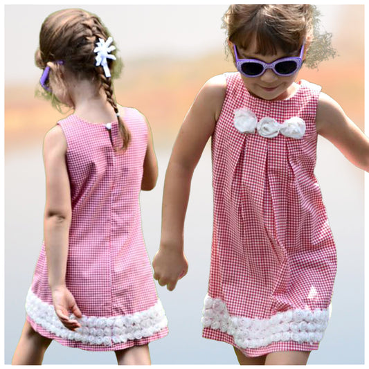 Pretty sleeveless summer dress with front pleats which open out. A-line shape, knee length. Sewing pattern and free video tutorial by Frocks & Frolics.