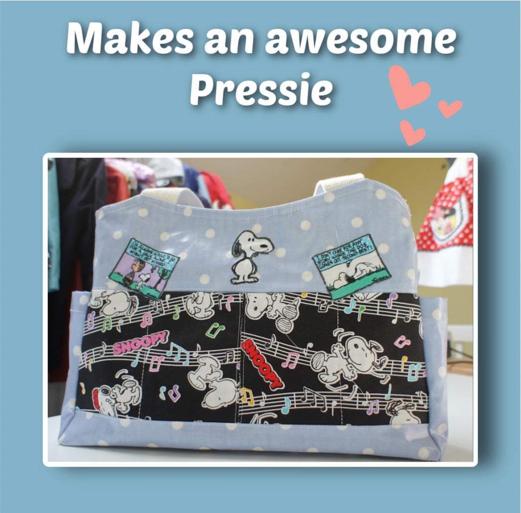 London tote bag pdf sewing pattern by Frocks & Frolics. In laminated oil cloth. Pink with dianty flowers. Wide handles and outside pockets. Fully lined, recessed zip. Comes with a free video course.