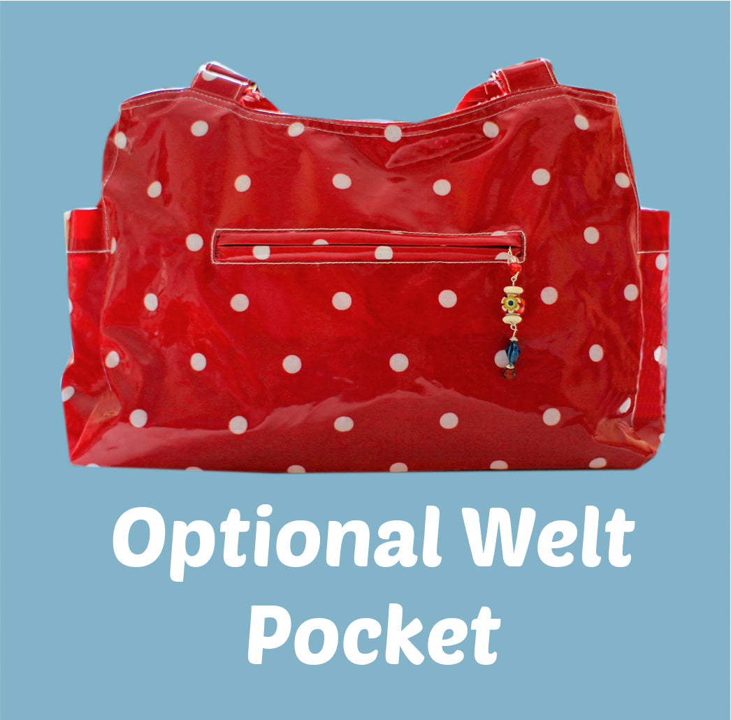 London tote bag pdf sewing pattern by Frocks & Frolics. In laminated oil cloth. Pink with dianty flowers. Wide handles and outside pockets. Fully lined, recessed zip. Comes with a free video course.