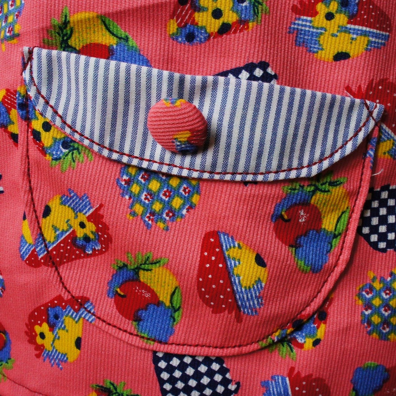 Megan dress pdf sewing pattern with Video tutorial. It's an A line shape, with no closure and a fold over front embellishment. It's fully lined and suitable for beginners. Easy project with cute patch pockets.