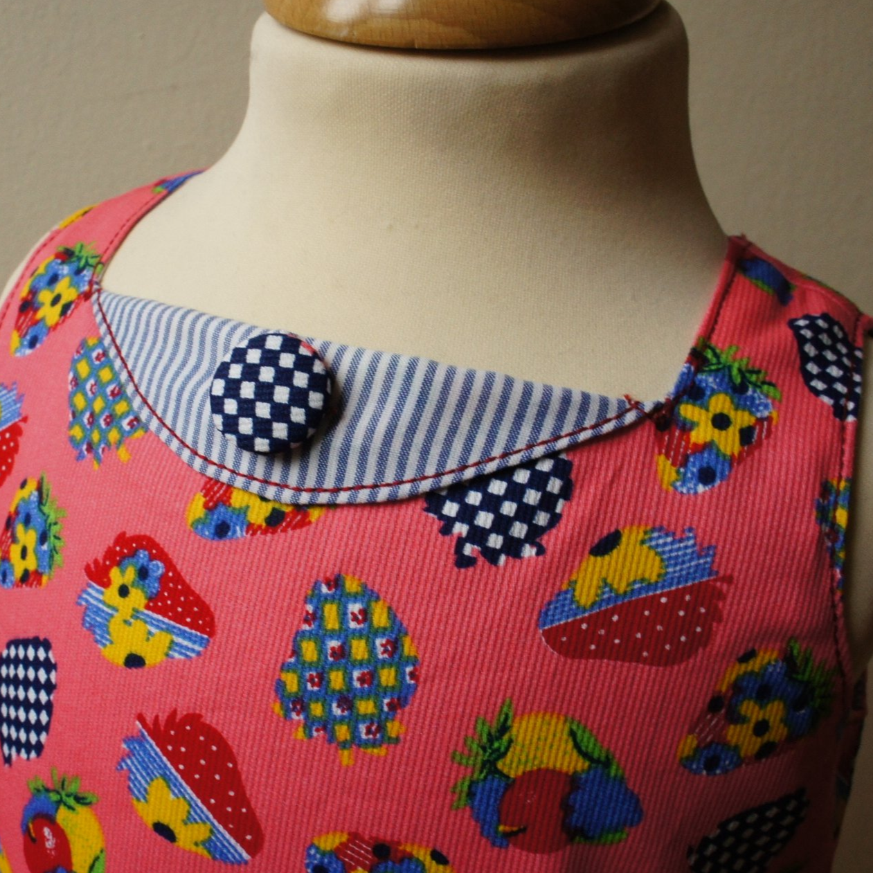 Megan dress pdf sewing pattern with Video tutorial. It's an A line shape, with no closure and a fold over front embellishment. It's fully lined and suitable for beginners. Easy project with cute patch pockets.