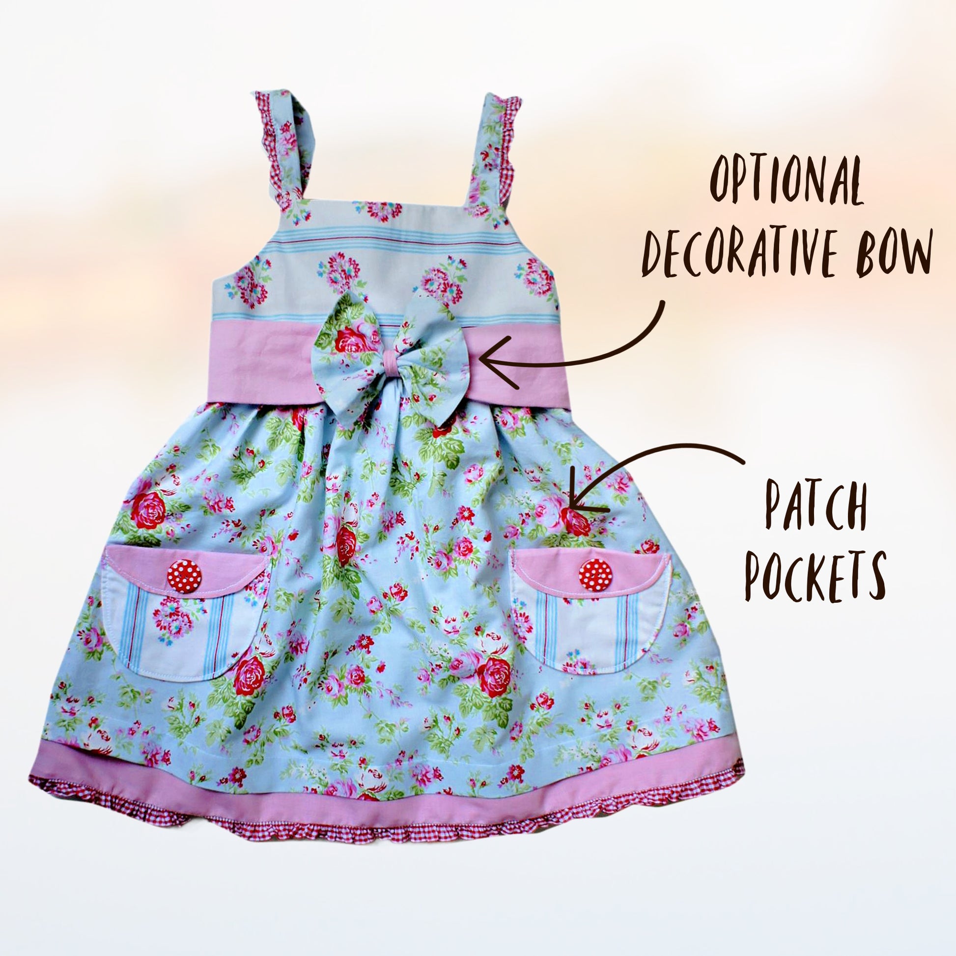 Natalie girls pinafore dress, pdf sewing pattern by Frocks & Frolics. High waist and sash with ties.  Here featuring a combination of Michael Miller fabrics in mushroom print and cute patch pockets. Double layer hem completes the look.