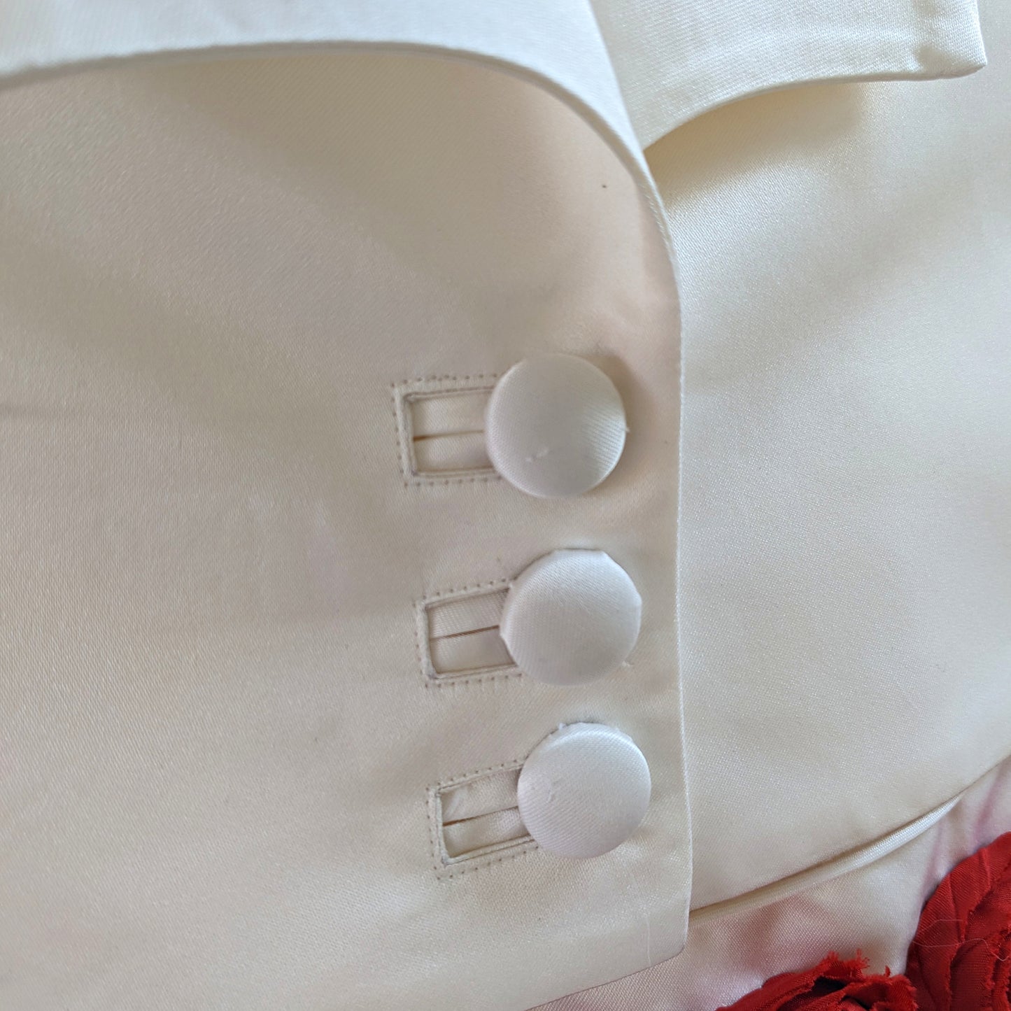 Paris bridal bolero, pdf sewing pattern, waist length bolero with three feature buttons, plain set in sleeves and ruffle hem. Here with the flower girl dress by Frocks & Frolics. With bound buttonholes video tutorial.