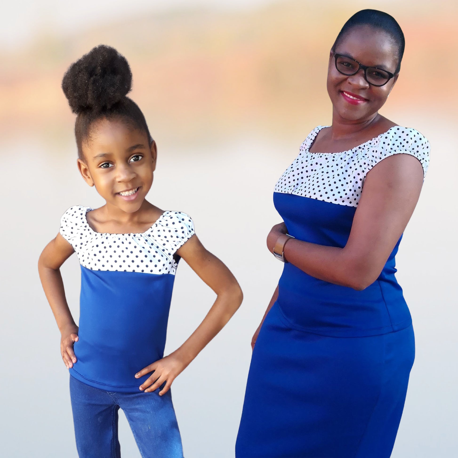 Rosalie peasant blouse pdf sewing pattern for women and girls. Made in knit fabric and woven fabric. Pattern by Frocks & Frolics. Image shows my tester Frieda and her daughter Magaret. She combined chiffon polka dot and blue scuba knit.