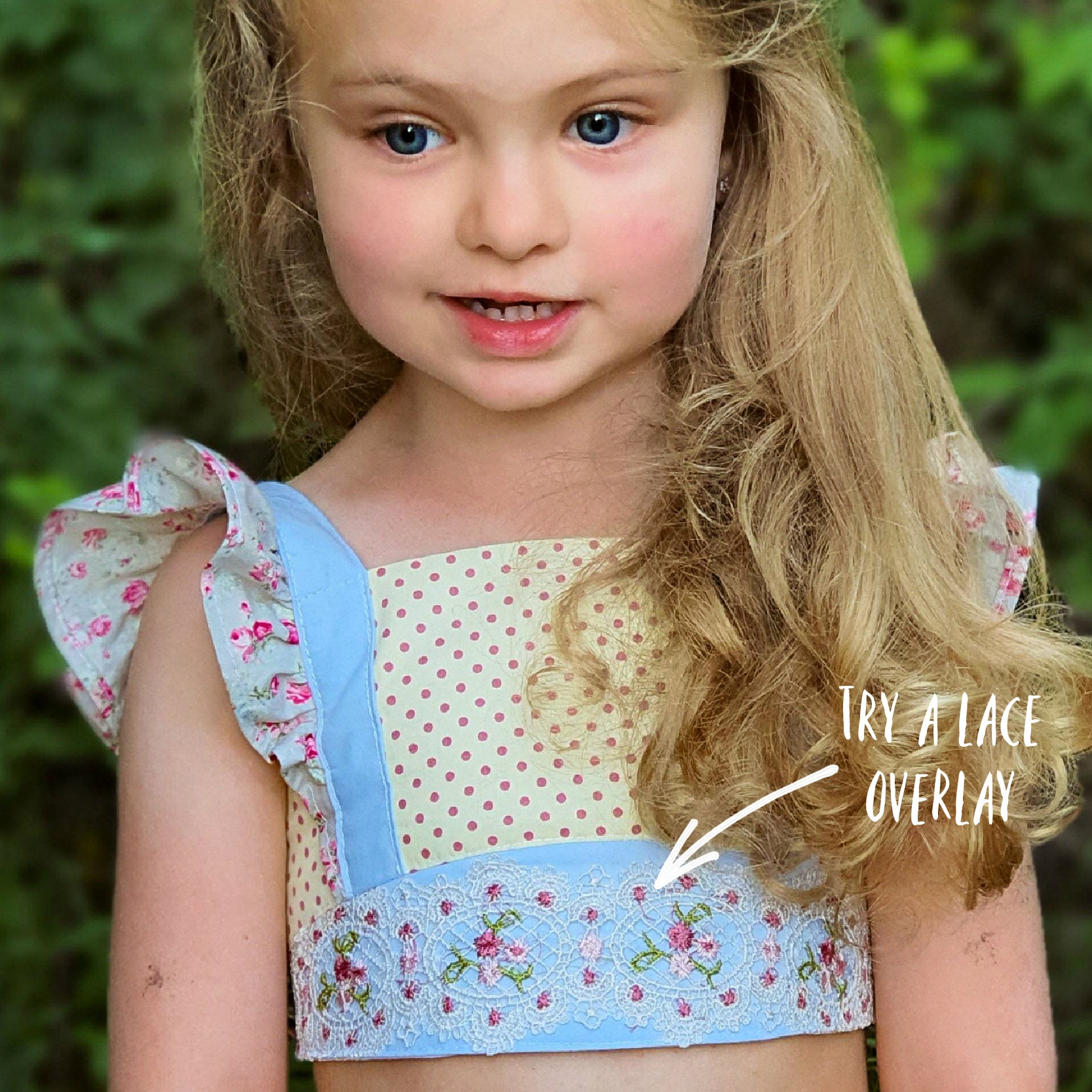 Tilly crop top, pdf sewing pattern by Frocks & Frolics. Cute girls blouse with flutter sleeves and vintage inspired. Made in a combination of fabrics, polka dots, a lace covered yoke and a dainty flower printfor the flutter sleeves.