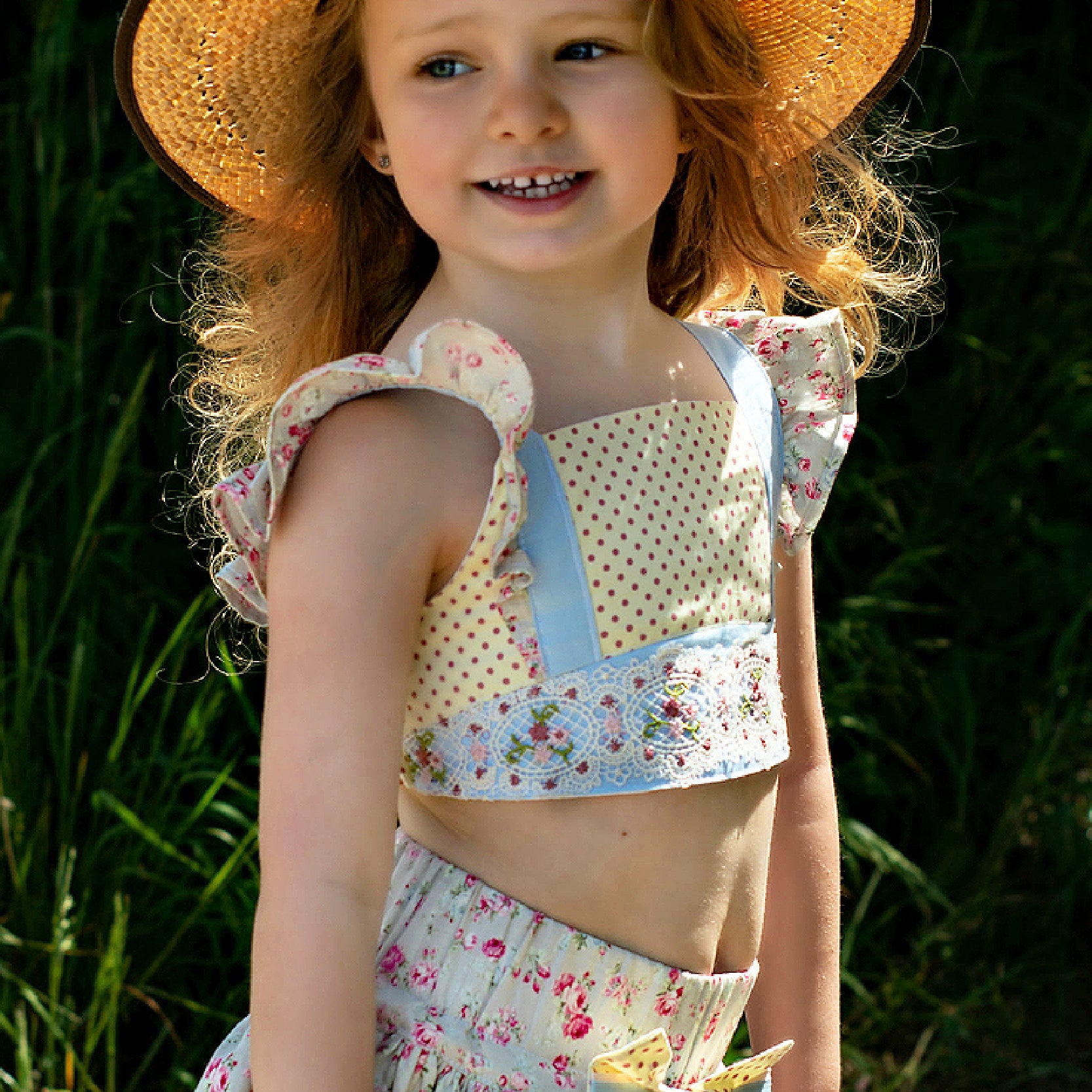 Tilly crop top, pdf sewing pattern by Frocks & Frolics. Cute girls blouse with flutter sleeves and vintage inspired. Made in a combination of fabrics, polka dots, a lace covered yoke and a dainty flower printfor the flutter sleeves.
