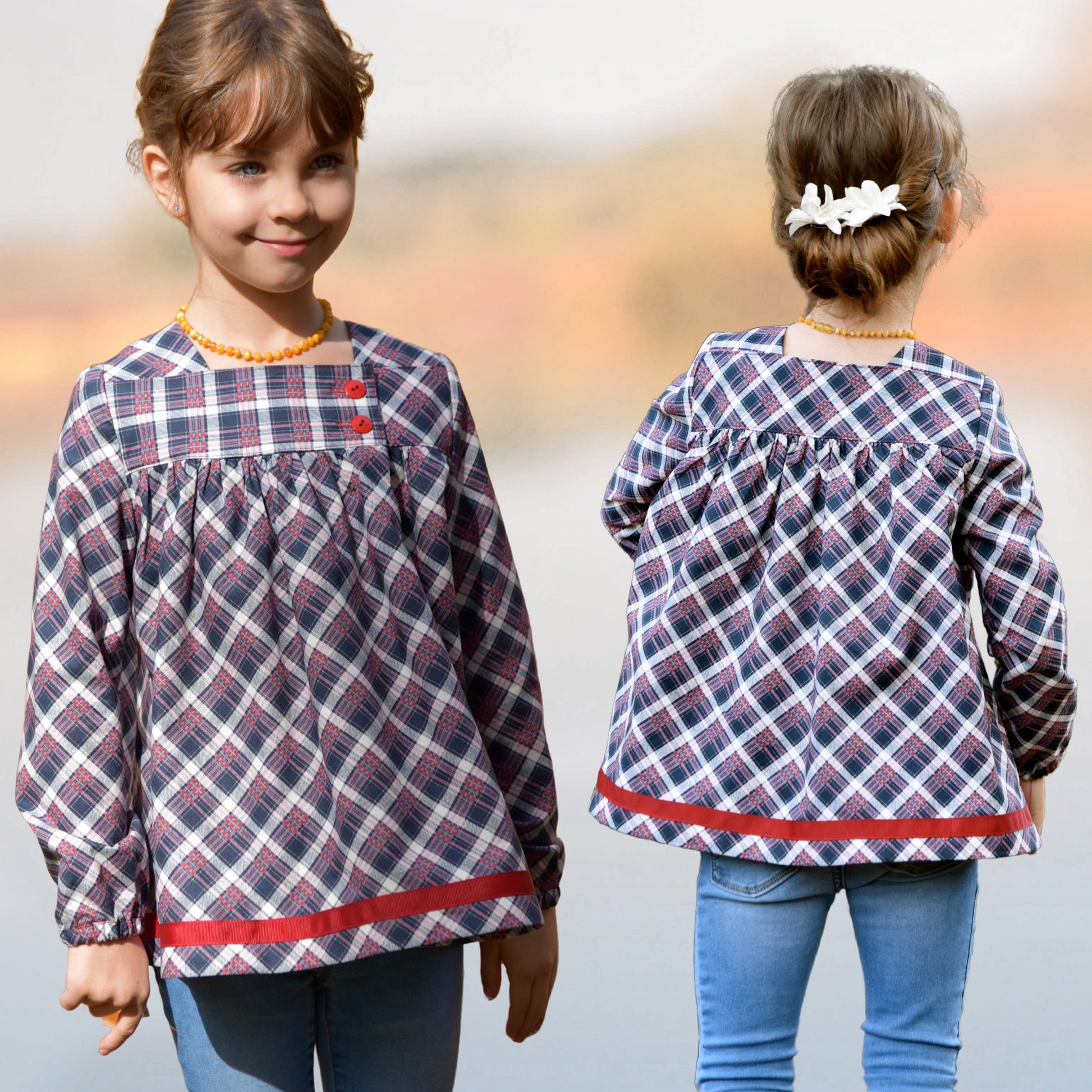 Virginia blouse pdf sewing pattern in nautical style fabrics. With ruffle hem trim and turn up cuff. Tudor neckline and asymmetrical front closure. The pattern includes a video sewing course for all the options.