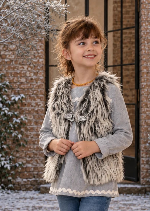 Baby Vest sewing pattern – girl in shaggy faux fur reversible vest with tie front, close-up