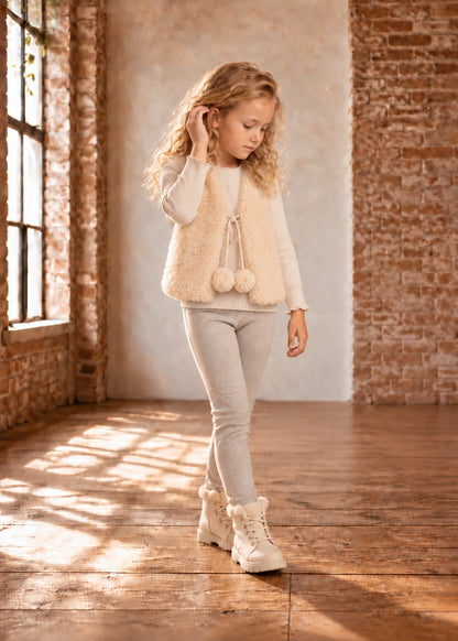 Baby Vest sewing pattern – longer cream teddy fleece vest with pom-pom ties, front view