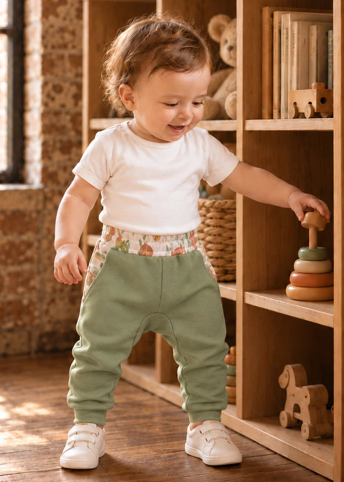 Bubble Gum Joggers sewing pattern – baby in sage joggers with floral waistband and white tee