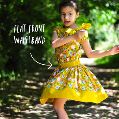 Betsy skirt, pdf sewing pattern by Frocks & Frolics. Skirt features a waistband with elastic in the back, a button down front and a deep hem trim. All version have step by step video tutorials completely free with the pattern.