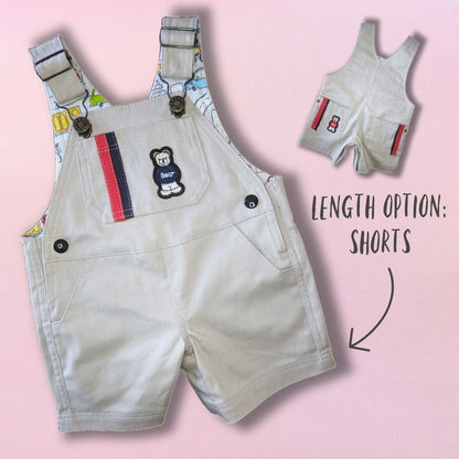 Bobby Dazzler overalls pdf sewing pattern. Short version. Classic dungaree pattern by Frocks and Frolics. Features leg opening for nappy changes, western pockets, a bib, snaps and metal jeans buttons. Sewing pattern includes a video course.